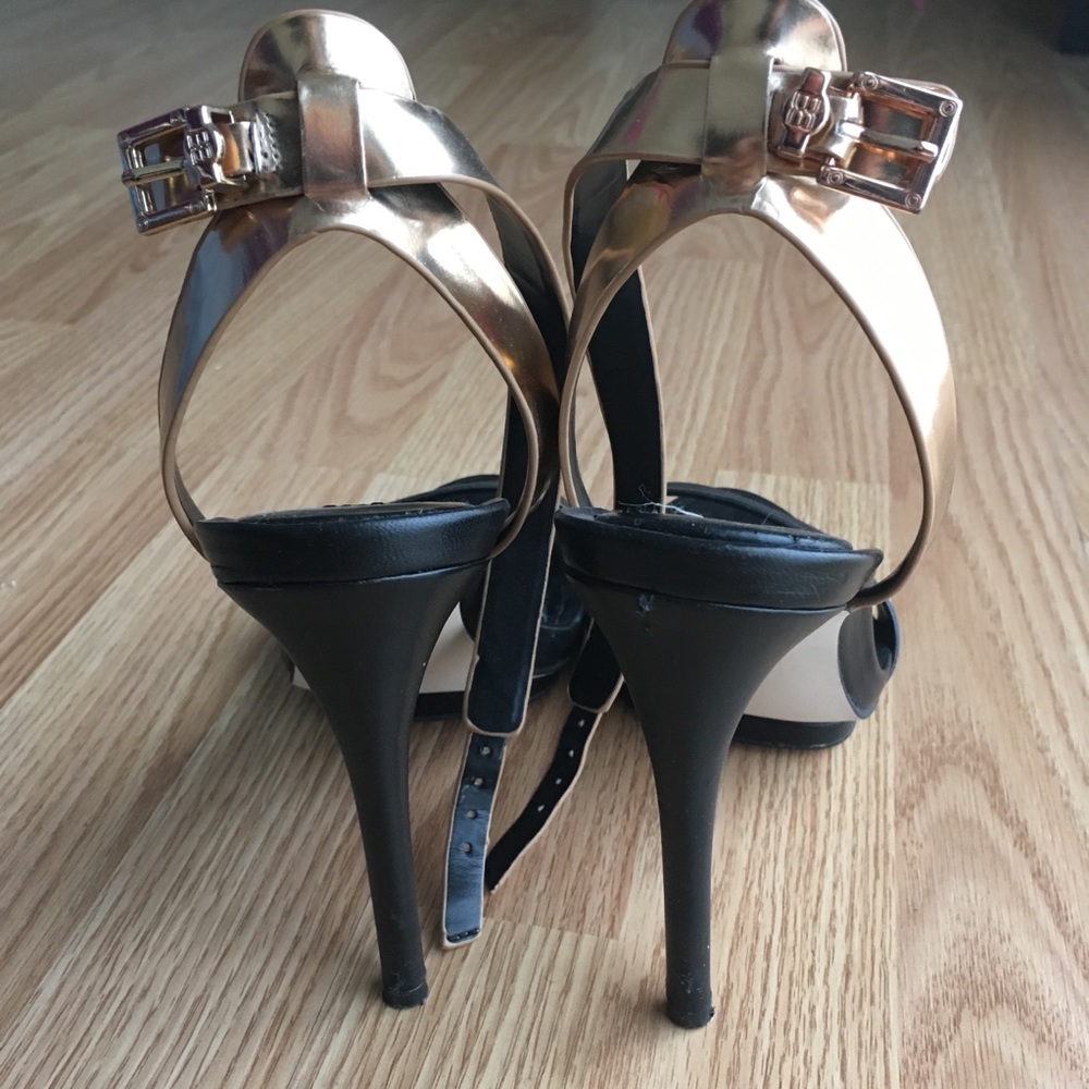 BCBGMAXAZRIA gold and black strappy stiletto heels
